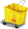 A Picture of product 534-101 Splash Guard™ Mop Bucket.  26 Quart.  Blue Color.  With 3" non-marking grey casters, embossed graduations and universal caution logo.