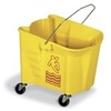 A Picture of product 534-106 Splash Guard™ Mop Bucket.  35 Quart.  Yellow Color.  3" non-marking gray casters.  Features embossed graduations and universal caution logo.